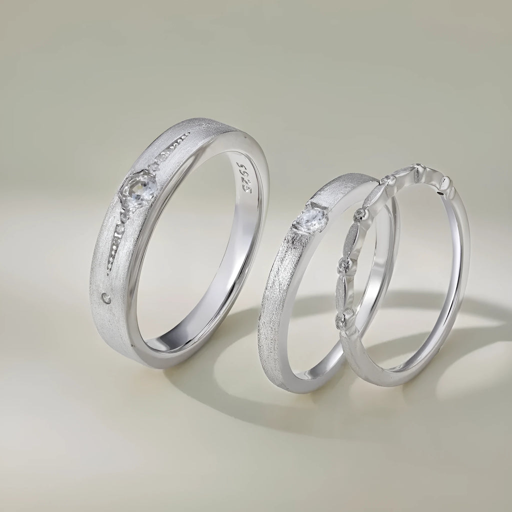 Sterling silver couple ring with geometric round diamond inlay in white gold finish on neutral background