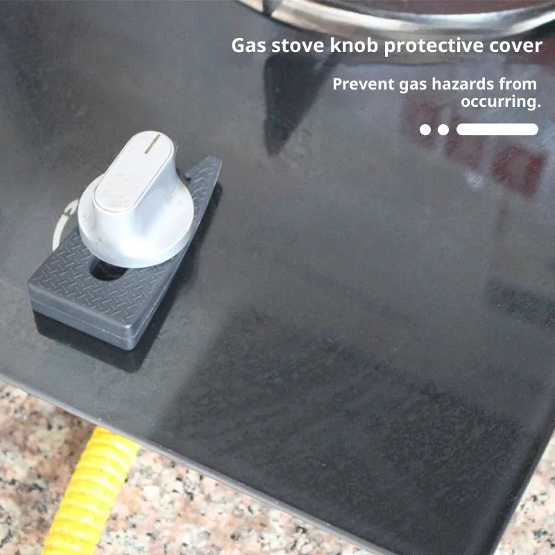 Gray plastic gas stove knob safety lock placed on a round kitchen stove knob
