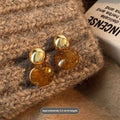 Three pairs of handmade geometric holiday earrings with tassel details in alloy with electroplated finish