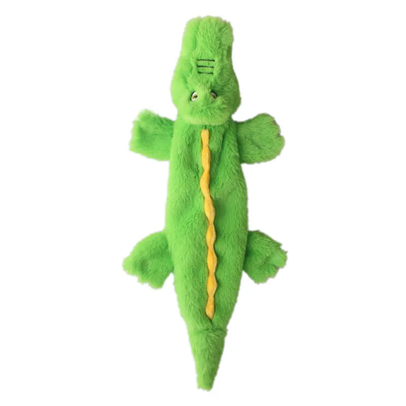 Green crocodile-shaped dog toy with squeaker in head and crinkle paper in tail