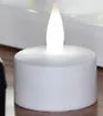 White plastic USB rechargeable LED candle lamp with flame-shaped head on plastic cup
