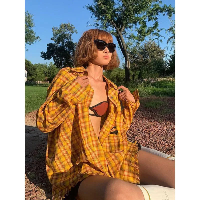 Dopamine Yellow loose fit plaid shirt for men and women on a hanger.