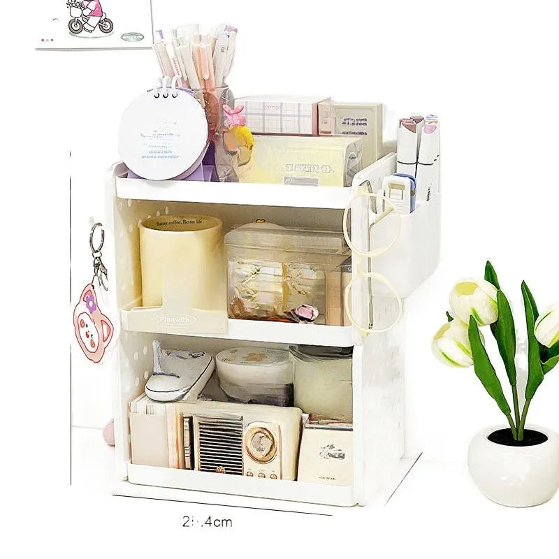 Beige plastic desktop wire-wrap board storage rack with three layers, two pen containers, and six hooks on a desk