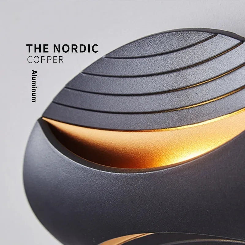 Modern minimalist aluminium wall lamp with IP65 rating, shown in black gold finish.