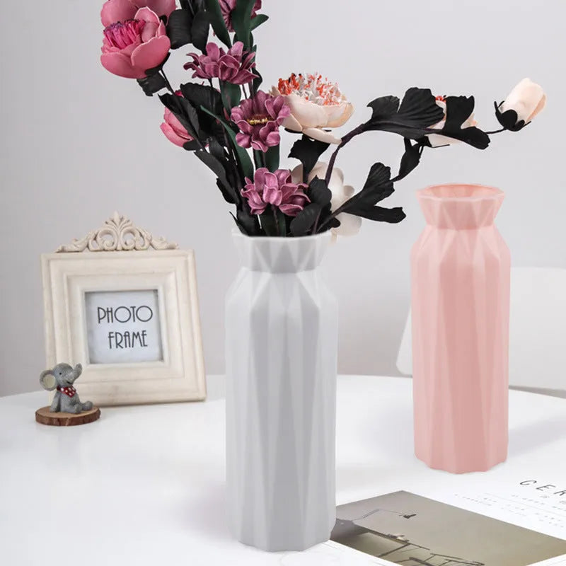Drop-resistant plastic melamine vase in green, grey, pink, or white colour on a table.