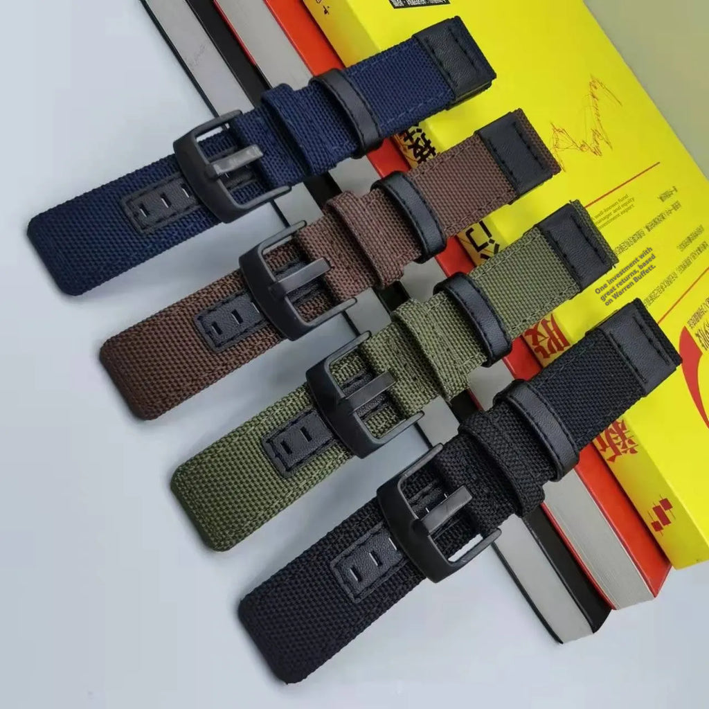 A canvas watch strap made from Oxford cloth in camouflage colour, showing the textured fabric and standard lug ends.