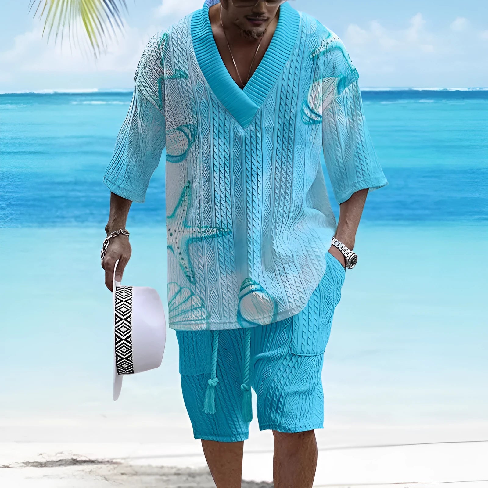 A man's loose-fitting casual short sleeve suit in a solid colour, featuring a short-sleeve top and matching shorts.