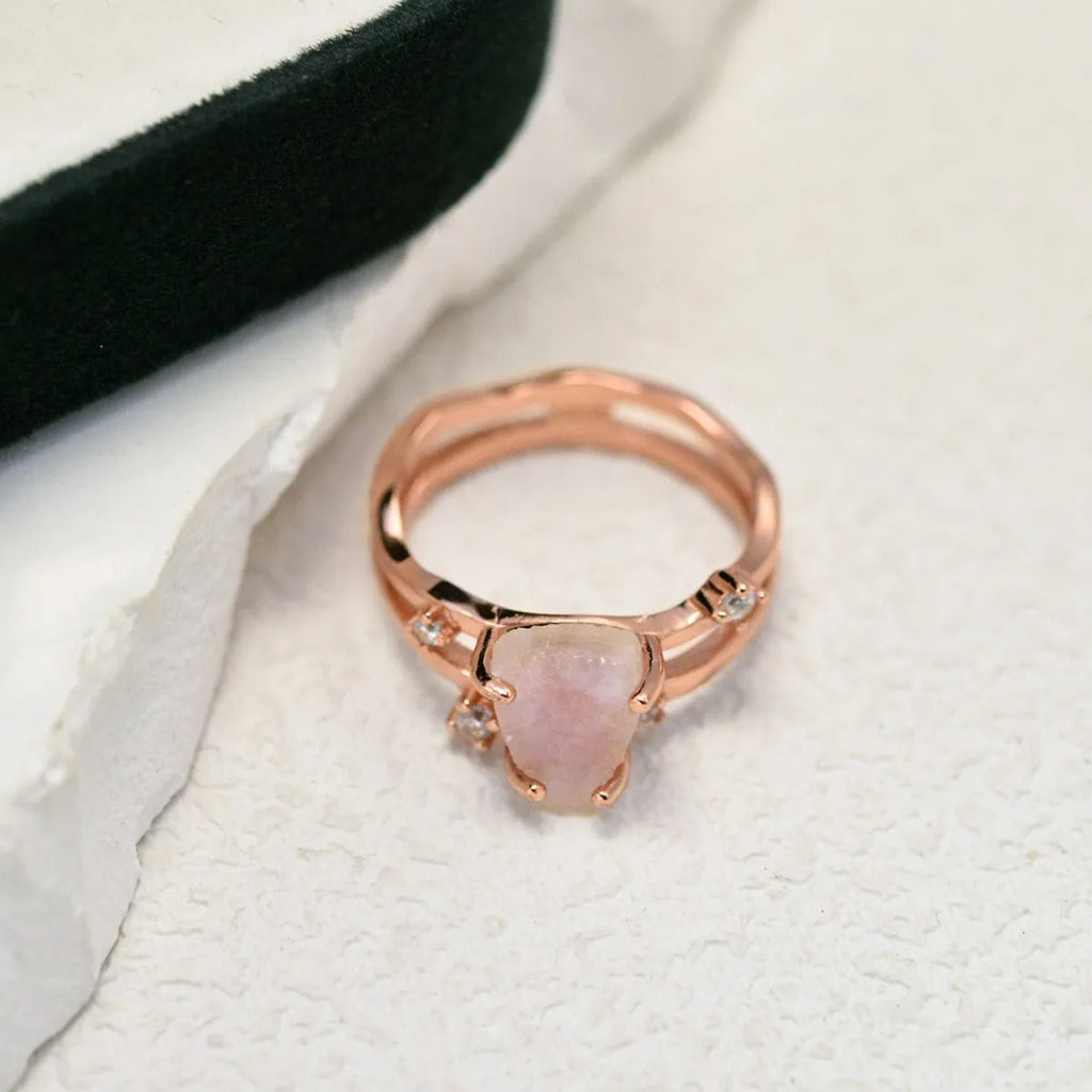 S925 silver geometric ring with irregular triangle shape and moonstone on a model's hand.