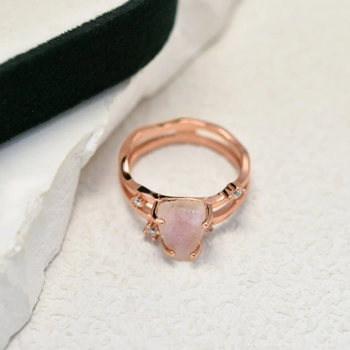 S925 silver geometric ring with irregular triangle shape and moonstone on a model's hand.