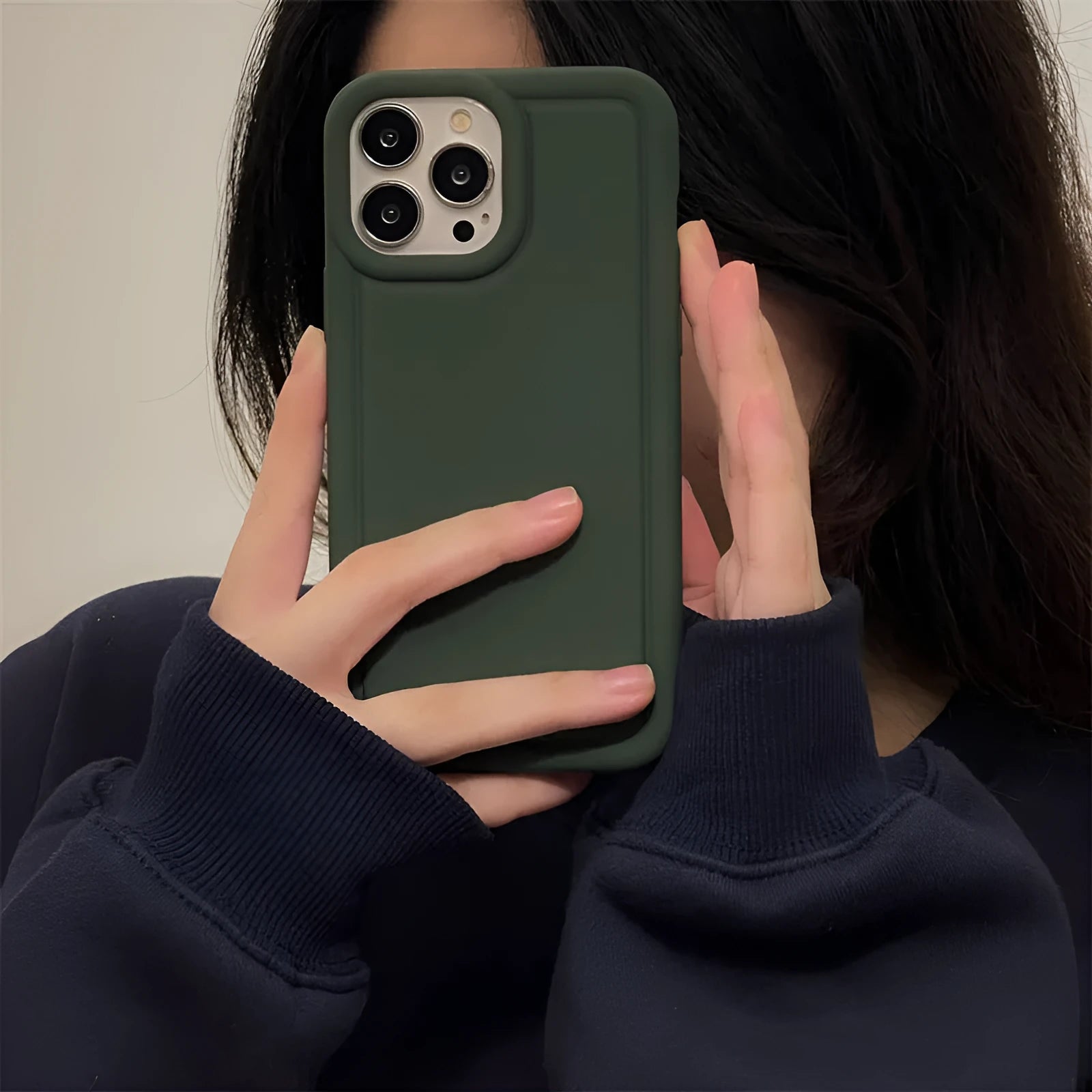 Silicone soft phone case for iPhone in black, showing rear cutout for camera and side buttons