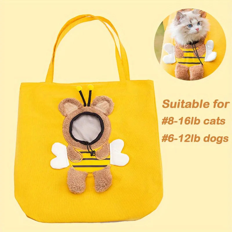 Blue canvas pet carrier shoulder bag with an open side showing a cat's head, featuring safety zippers and an animal print design.