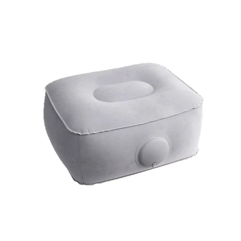 Grey inflatable seat cushion with a press valve, shown folded and inflated.