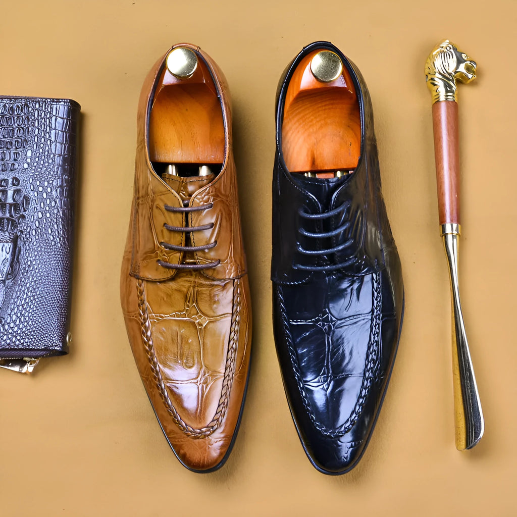 Men's black leather business shoes with alligator pattern texture and a gold horse bit buckle.