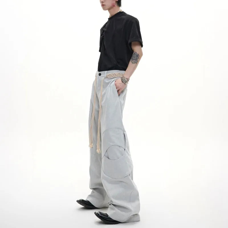 Men's dark blue straight-leg cotton jeans with heavy 3D belt stitching and zip decoration.