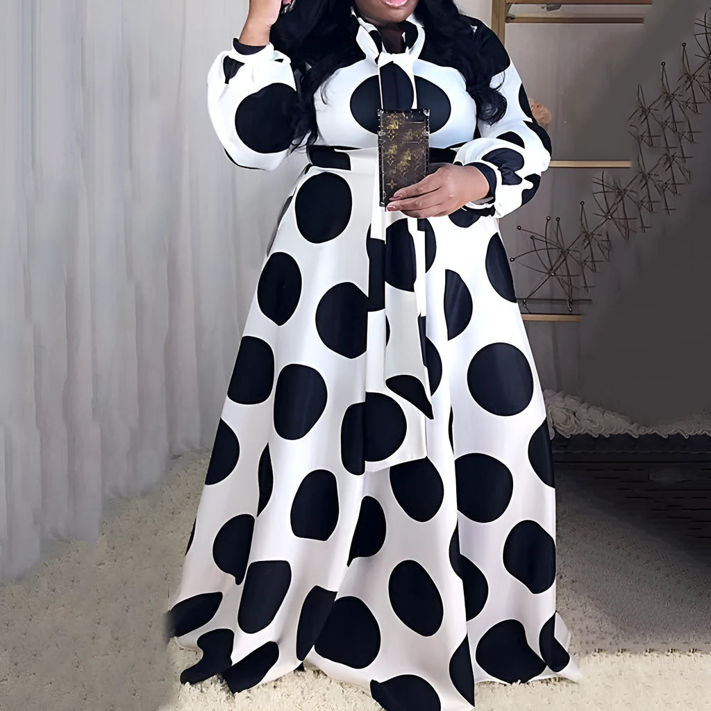 Women's large size white polka dot dress with long sleeves and long skirt, front view