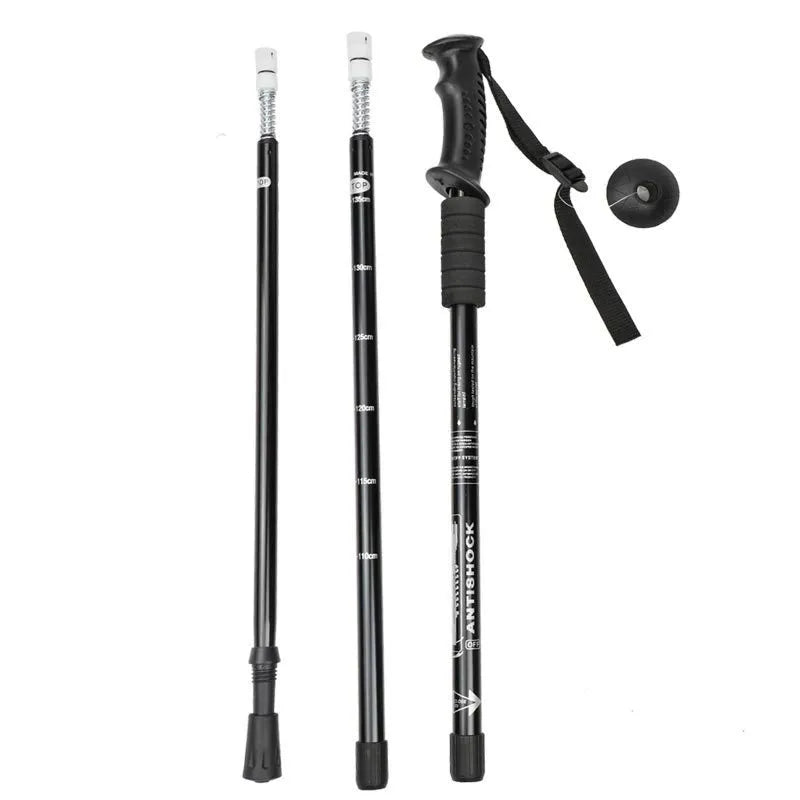 Aluminium alloy adjustable trekking pole extended to full length with mud support accessory attached