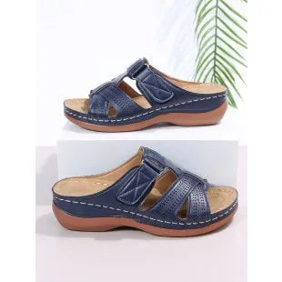 Women's black hollow peep toe wedge sandals with a Velcro strap closure