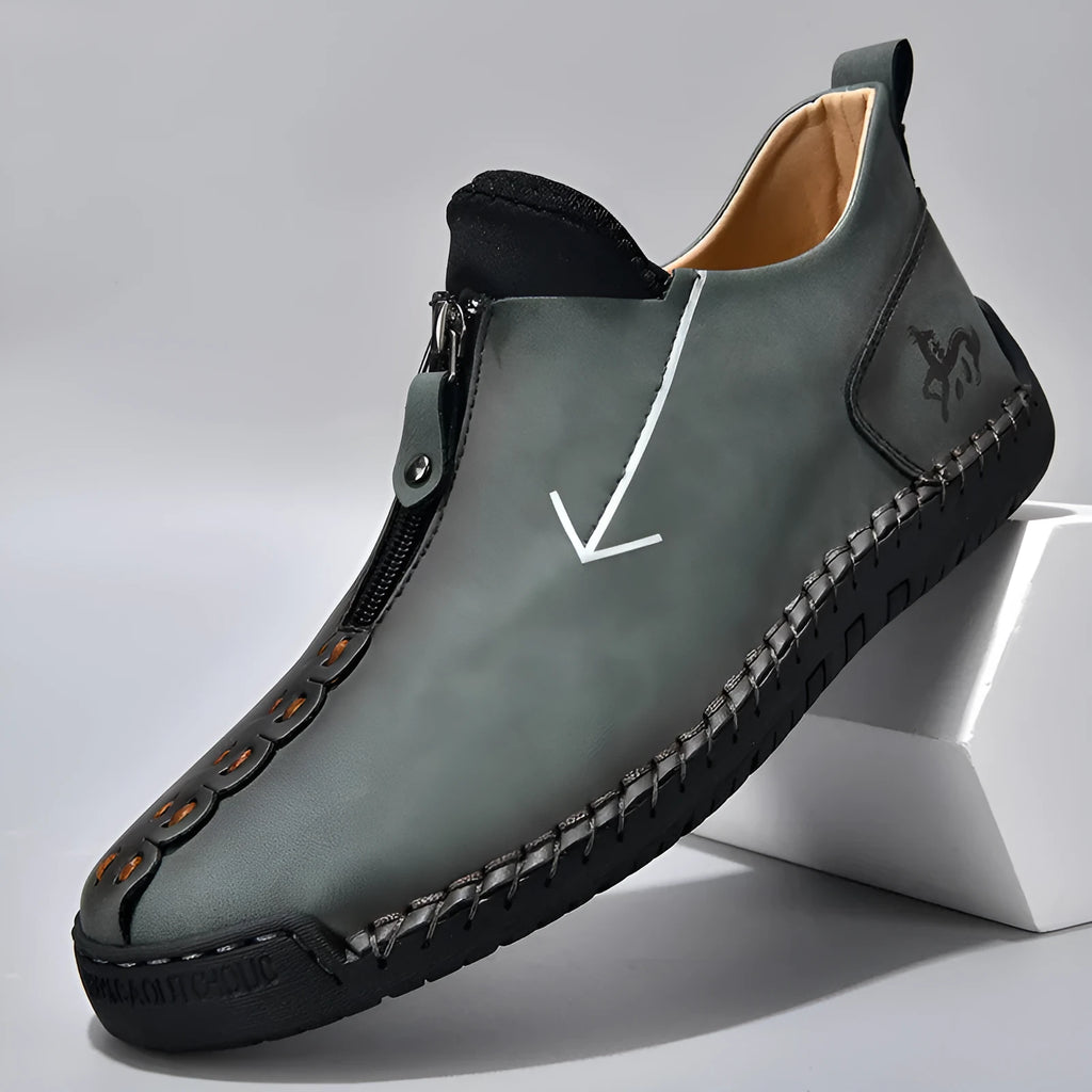 Men's black casual leather boots with a front side zipper and a hand-stitched rubber sole.