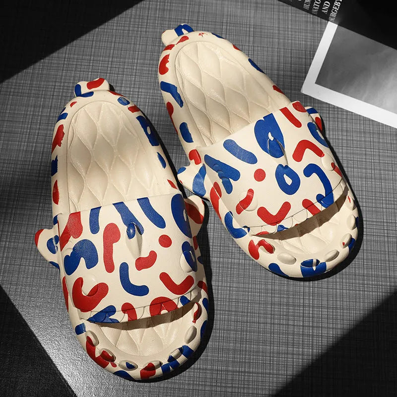 Pair of open-toe EVA home slippers with a shark design on a white background.