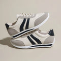 Red and blue low top lace-up leisure sneaker with PU mesh upper and rubber sole.