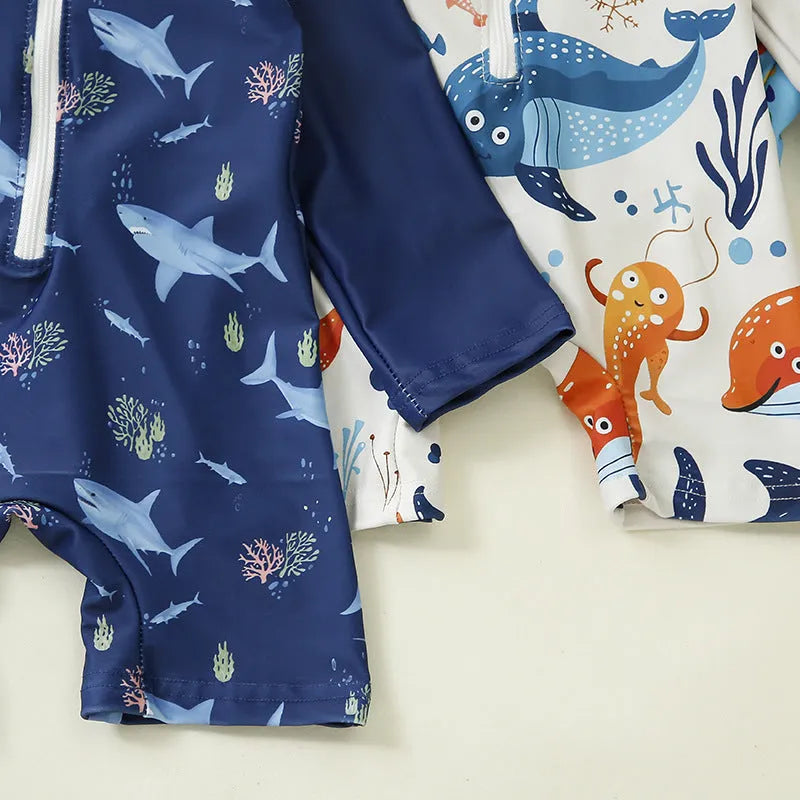 Children's one-piece jumpsuit swimsuit with matching hat in dark blue shark print, made from polyester