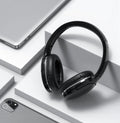 Black and white wireless Bluetooth sports gaming headset with subwoofer shown from the side.