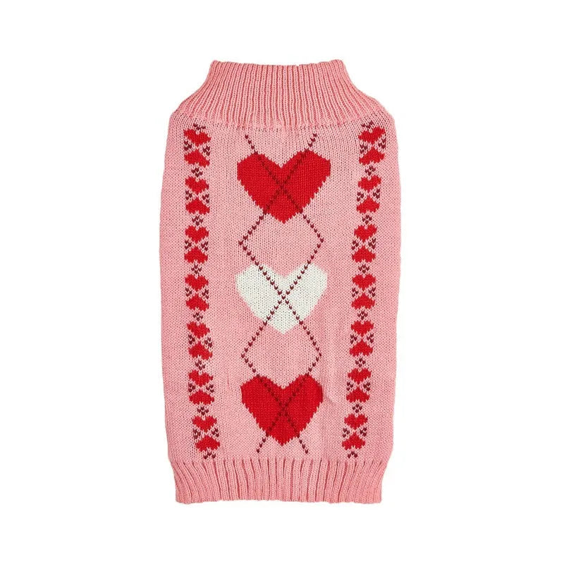 Dog wearing acrylic sweater with embroidered bow and heart patterns