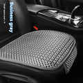 Ice silk car seat cushion in warm cream colour with flat minimalist design sitting on a car seat.
