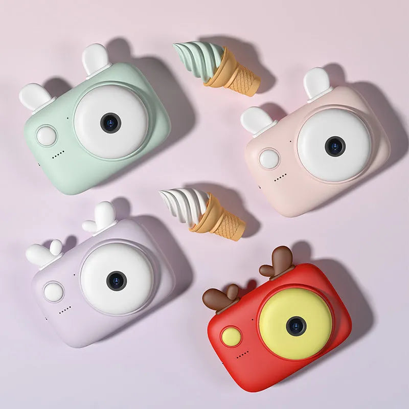 A2 Kids Macaron style digital camera in choice of colours, showing compact design with lens and 2.4-inch screen.