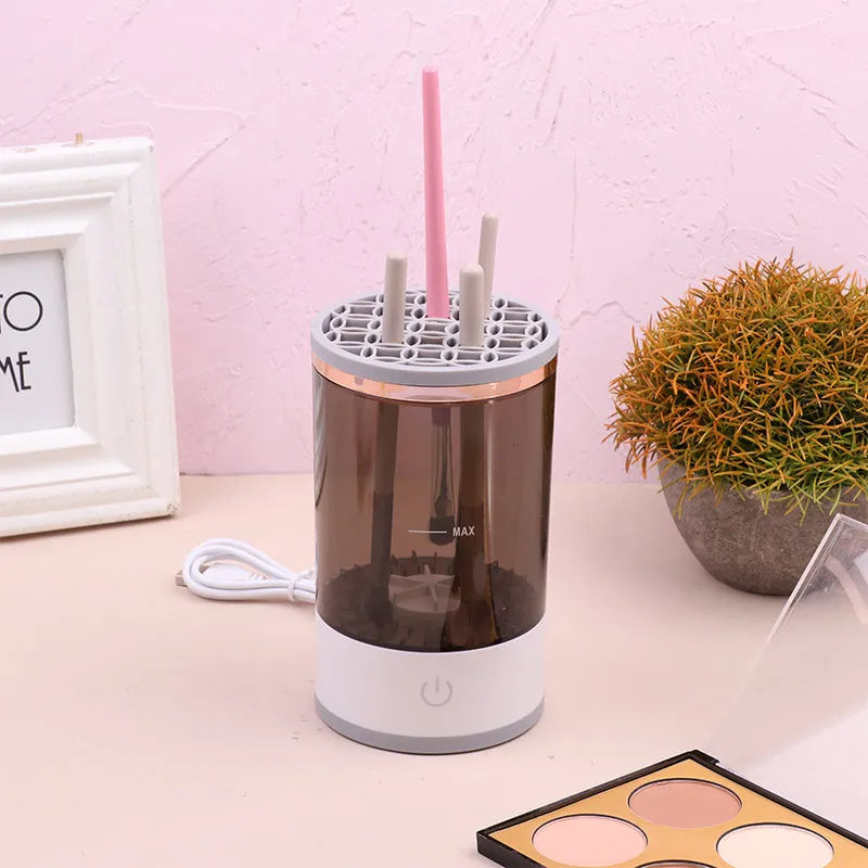 Electric makeup brush cleaner in grey and white with brush inserted, 17x9x9 cm, USB charging