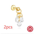 S925 sterling silver moon and star earrings with diamond accents on a gold-coloured background.