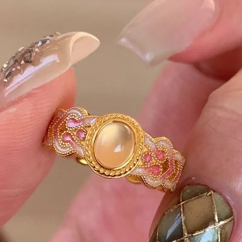 Women's geometric open ring with pink crystal enamel on gold-plated copper band