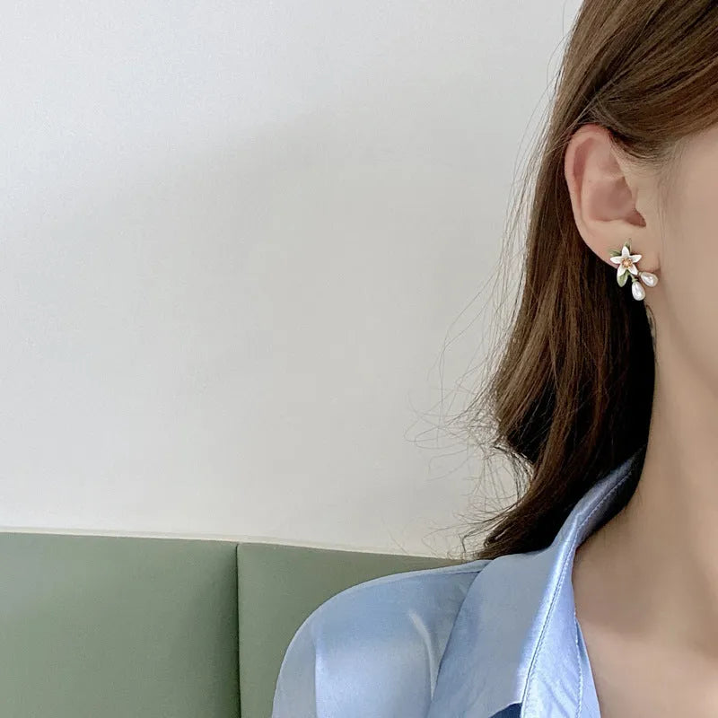 Alloy flower ear stud and clip set with sterling silver needle camellia design and contrasting colour floral motif