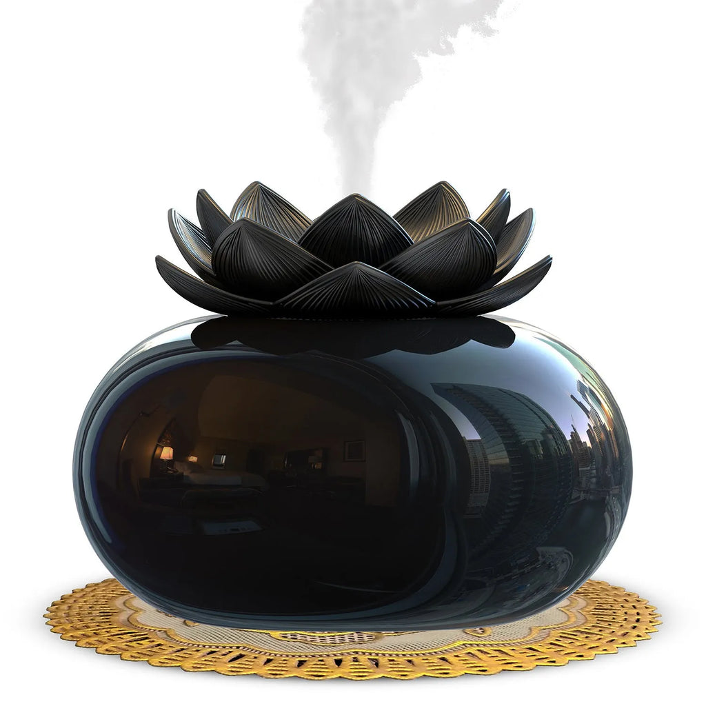 Pure black lotus-shaped aromatherapy humidifier with USB cable on a desk