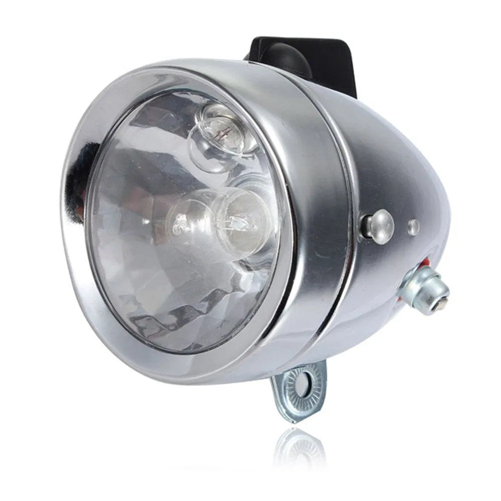 Silver bicycle dynamo-powered generator light kit for mounting on frame, showing wiring connectors.