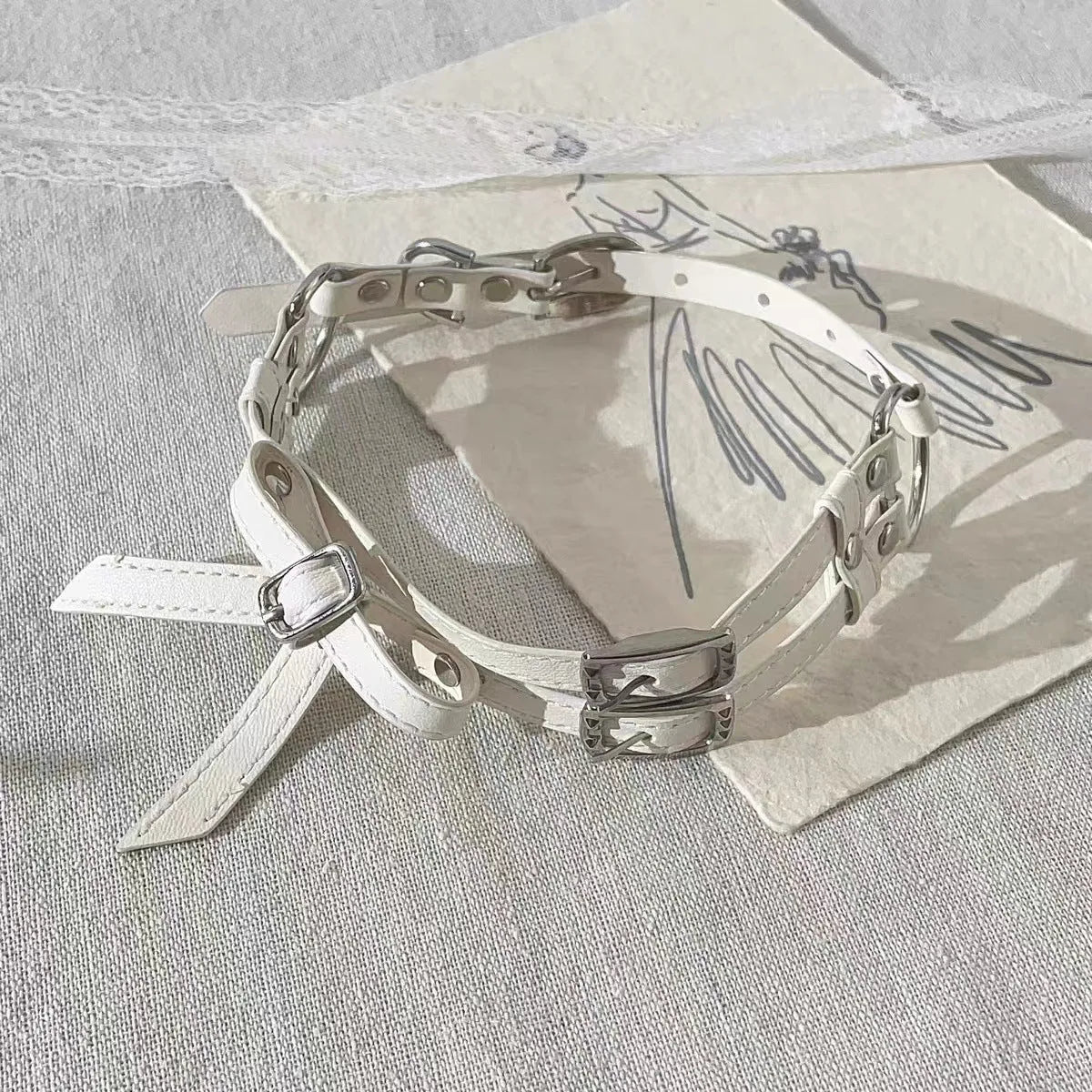 Women's cool white bow leather necklace with electroplated alloy pendant on leather cord