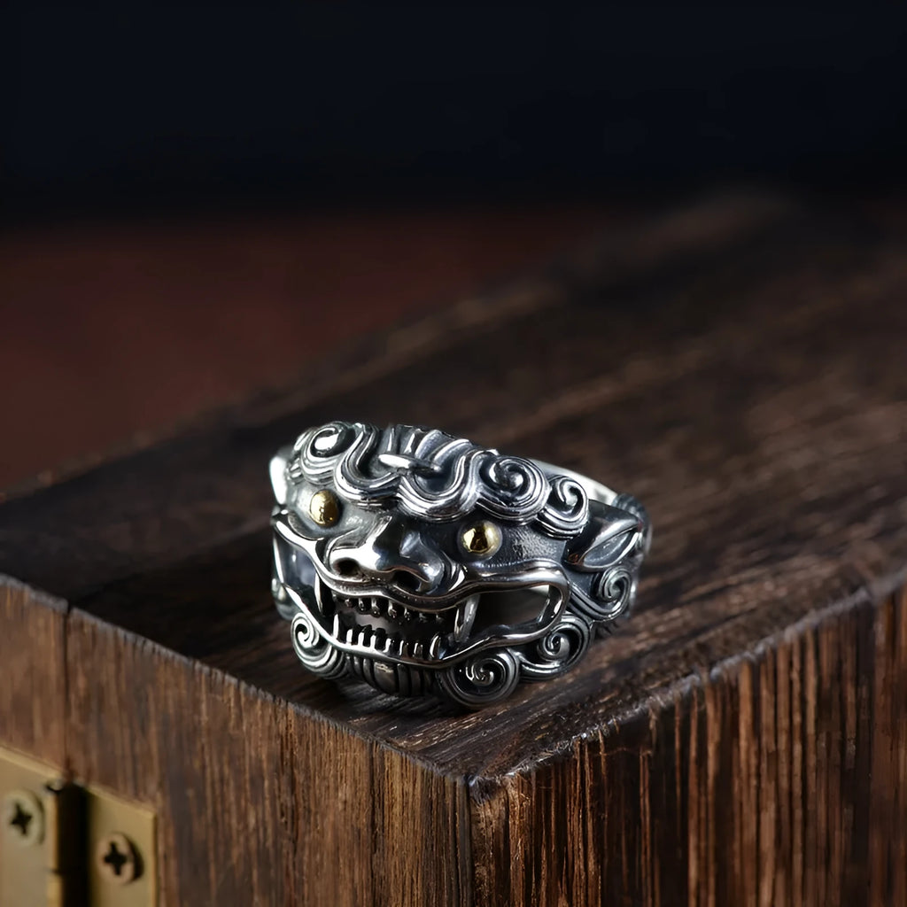 Silver open ring with a detailed Jibeast animal zodiac pattern and diamond design on a white background.