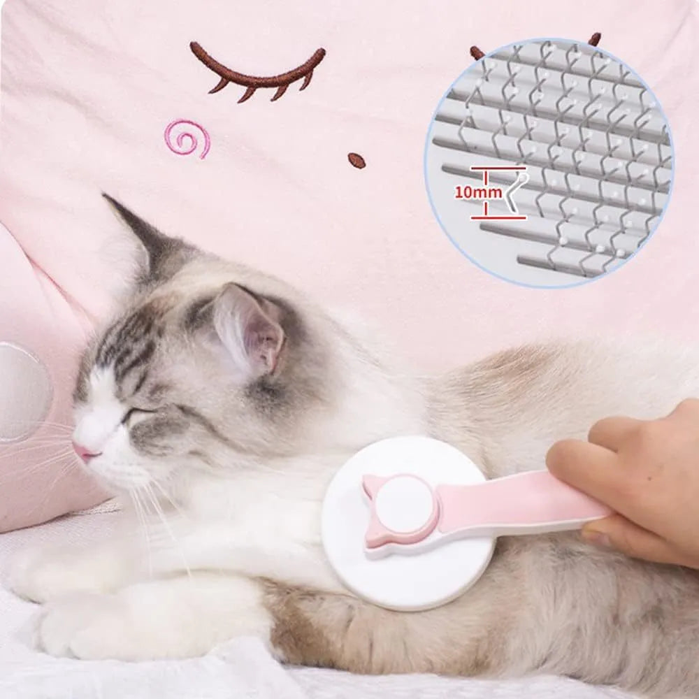 Self-cleaning pet brush with blue rubber handle and metal pins, shown with removed fur.