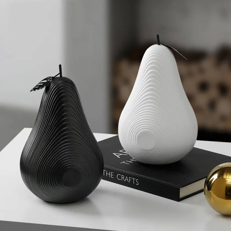 Solid resin apple figurine with smooth apple finish, 17cm high, in black colour on a shelf