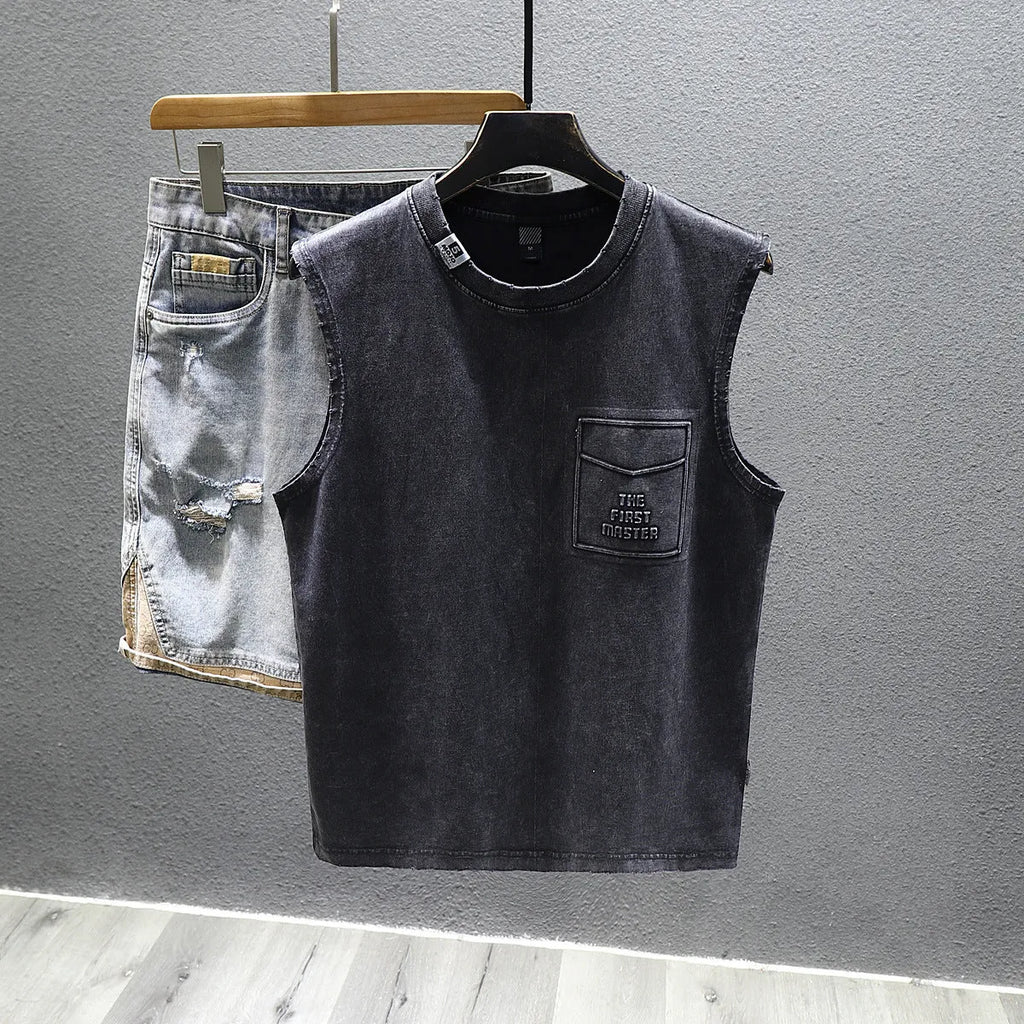 Women's solid black cotton sleeveless t-shirt with a loose fit and straight hem.