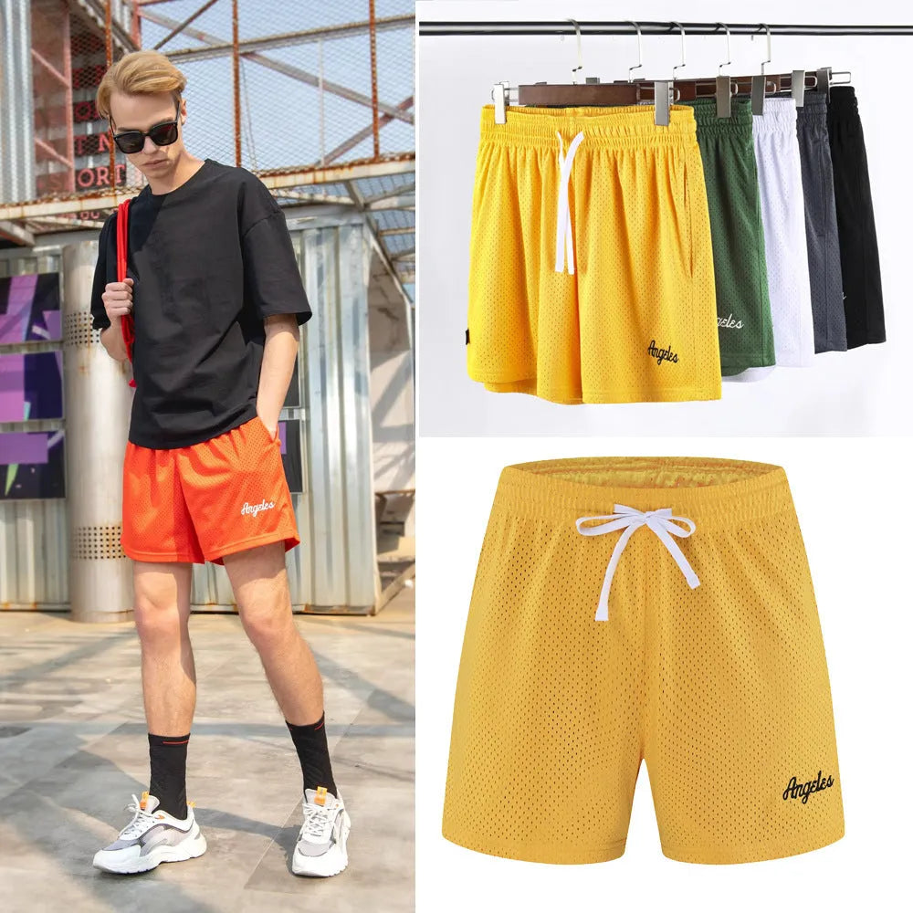 Men's black double-layer mesh shorts laid flat, showing sporty design and mesh fabric texture.