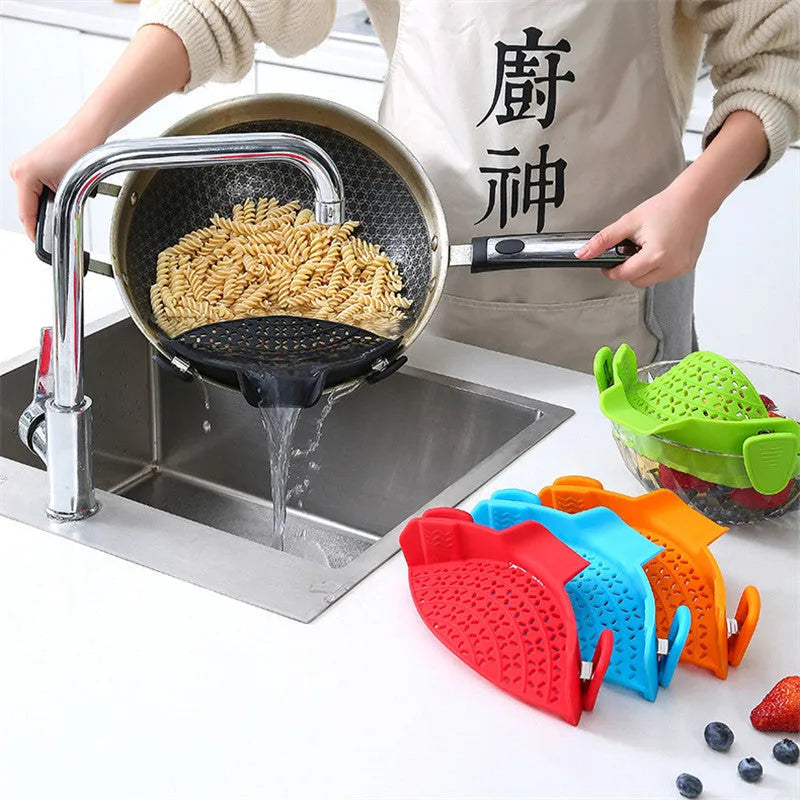 Silicone and stainless steel pot drain stopper kitchen gadget in assorted colours.