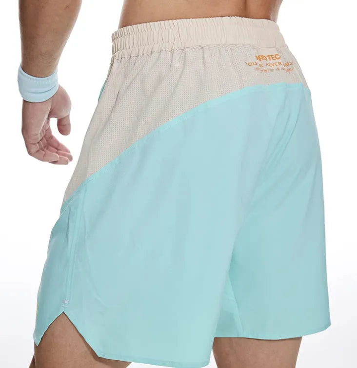 Men's loose fit workout shorts in dark rock ash colour with elastic waistband and lace-up front for gym training