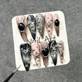Long pointed press-on false nails with embossed relief and hand-painted metal detail in XS S M L sizes