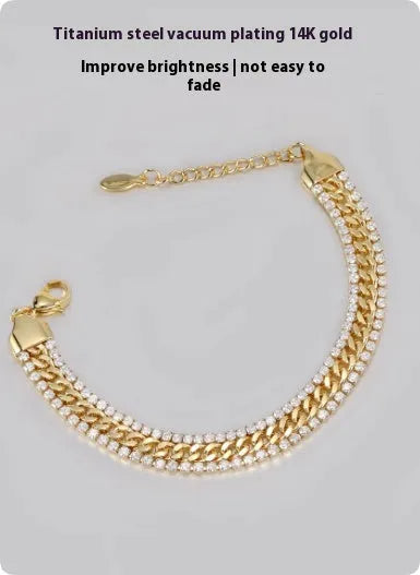 Gold-coloured hip hop style tennis bracelet for men and women on a wrist.