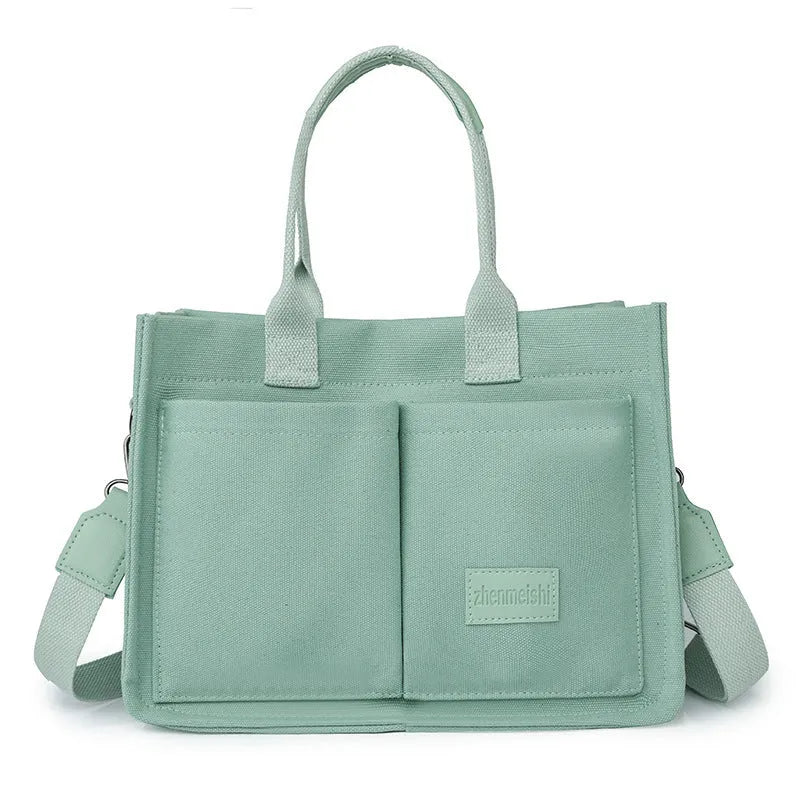 Large capacity canvas tote bag for women with multiple pockets and crossbody strap in creamy white