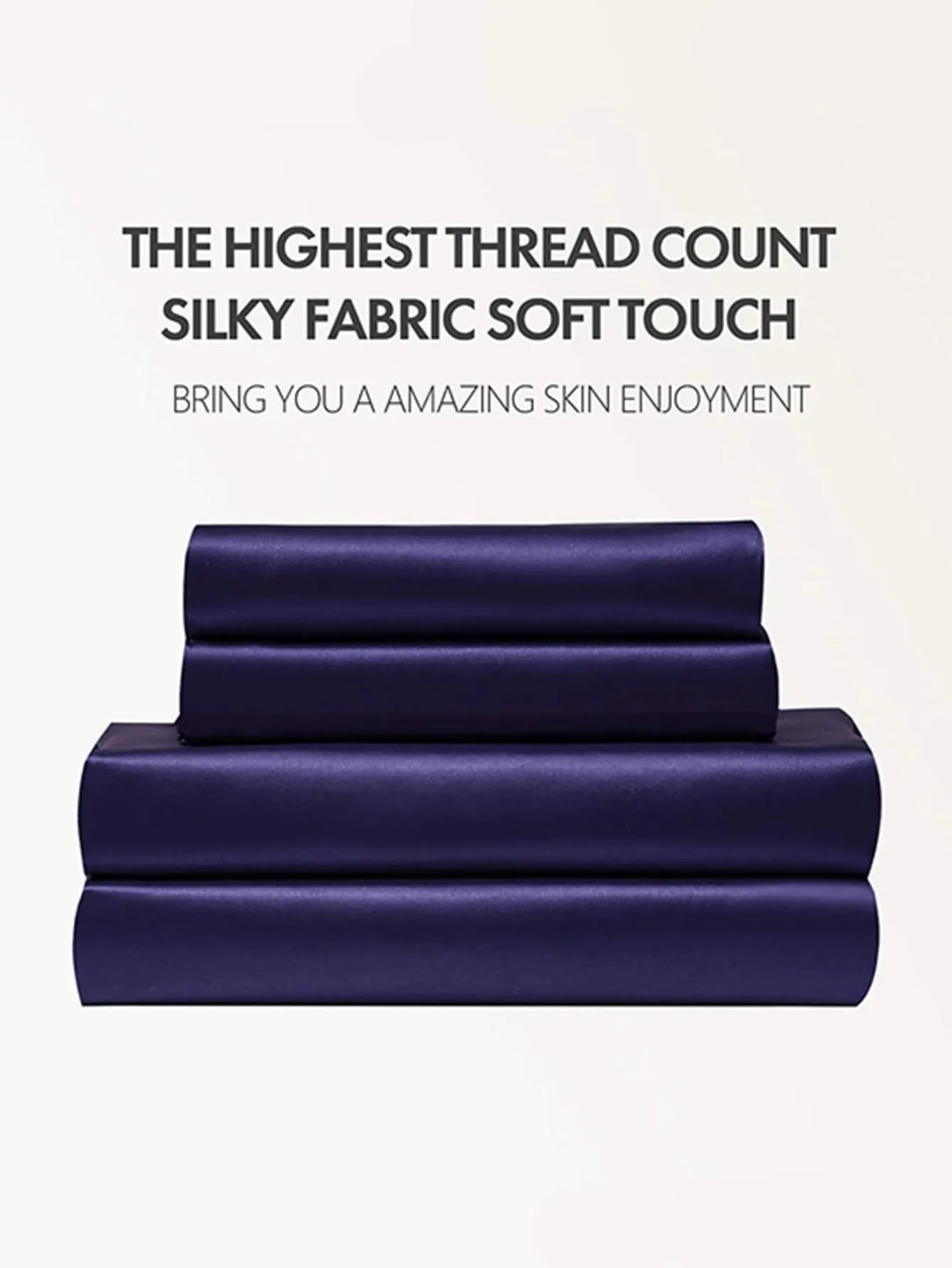 Four-piece imitation silk bedding set with satin weave in Navy Blue on a bed