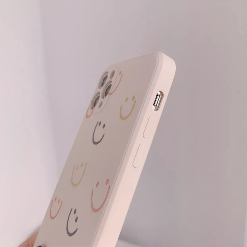 Simple silicone iPhone case with smiley face design in multiple colour options