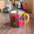 Hand-painted book-themed resin coffee cup ornament for decorative display.