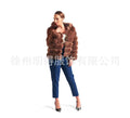 Women's loose fit artificial fur hooded coat in white silver fox colour on a hanger.